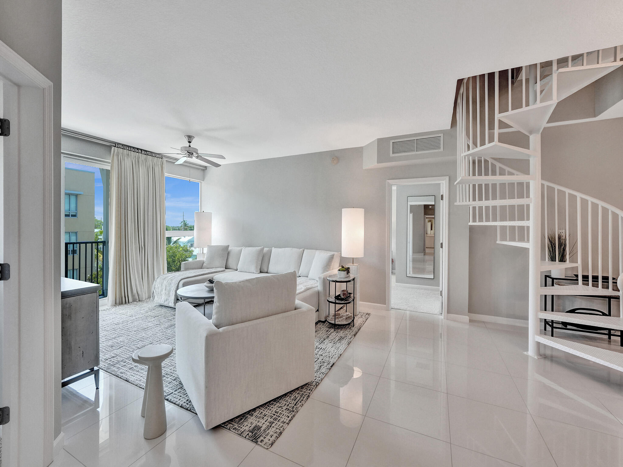 225 Northeast 1st Street, Unit 412 Delray Beach, FL 33444 - Photo 10 of 49 a living room with furniture and a table