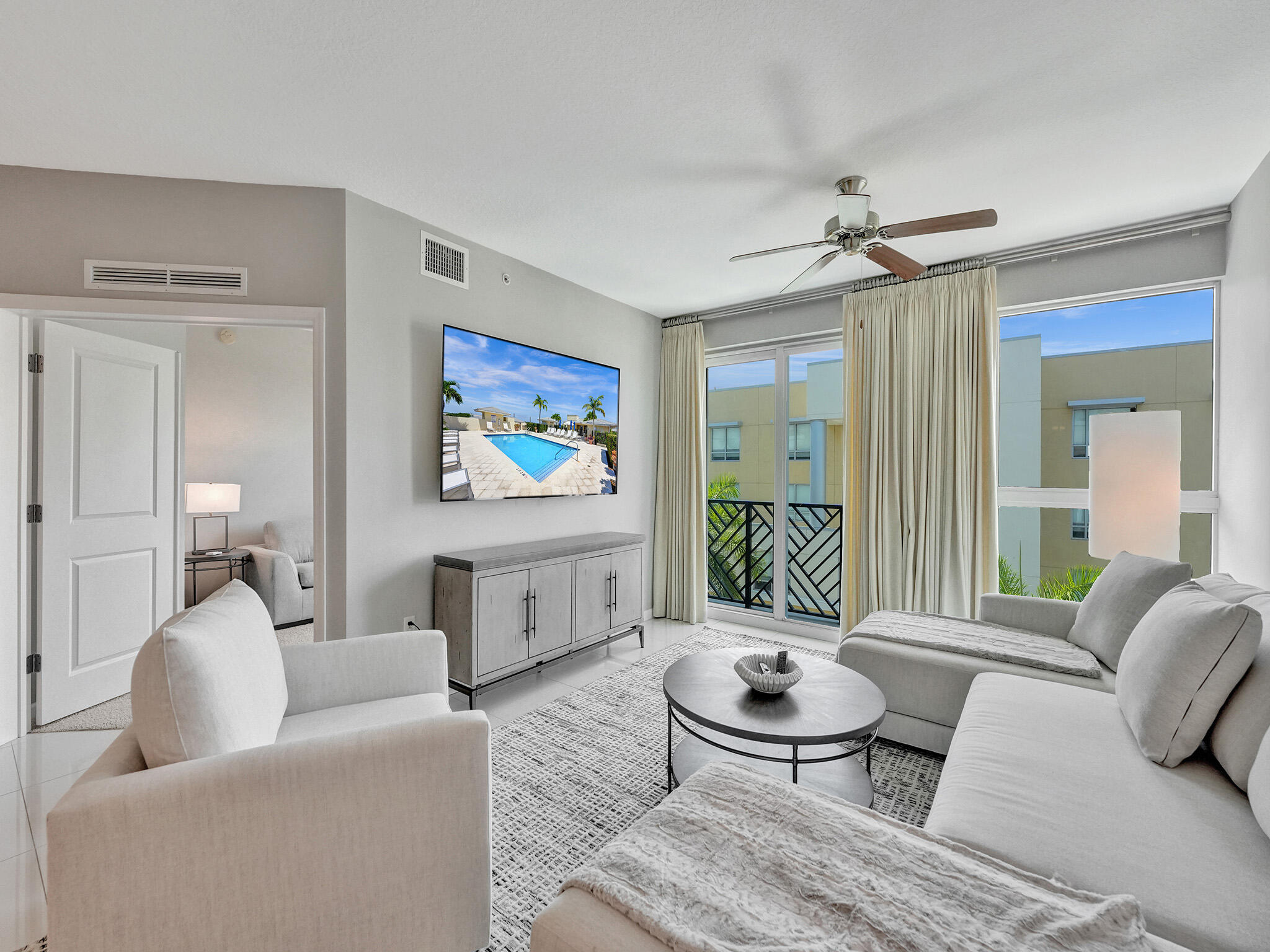 225 Northeast 1st Street, Unit 412 Delray Beach, FL 33444 - Photo 15 of 49 a living room with furniture a rug and a table