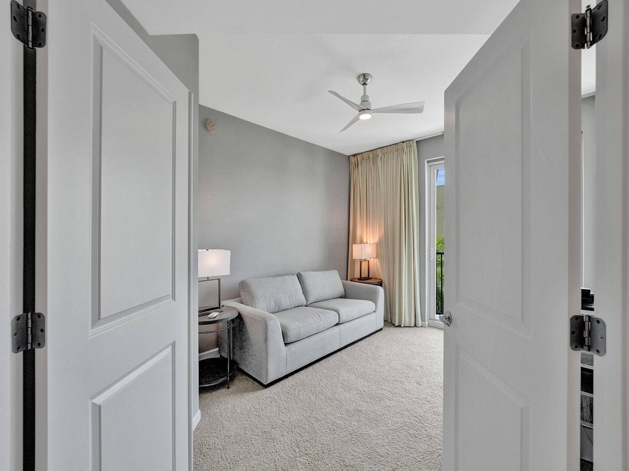 225 Northeast 1st Street, Unit 412 Delray Beach, FL 33444 - Photo 16 of 49 a living room with furniture and a ceiling fan
