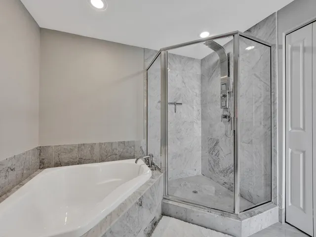 a bathroom with a shower sink and mirror