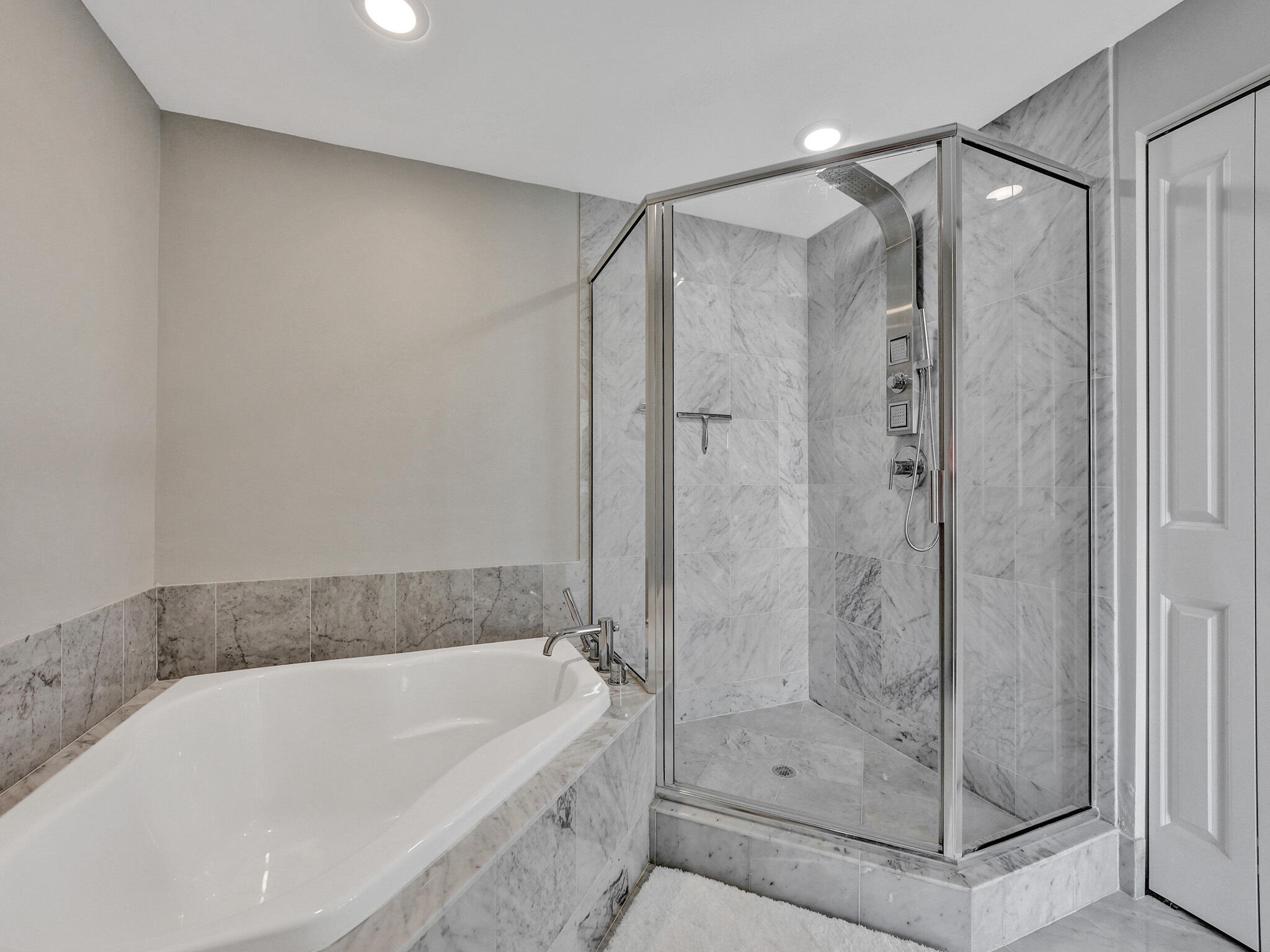 225 Northeast 1st Street, Unit 412 Delray Beach, FL 33444 - Photo 35 of 49 a bathroom with a bathtub and a shower