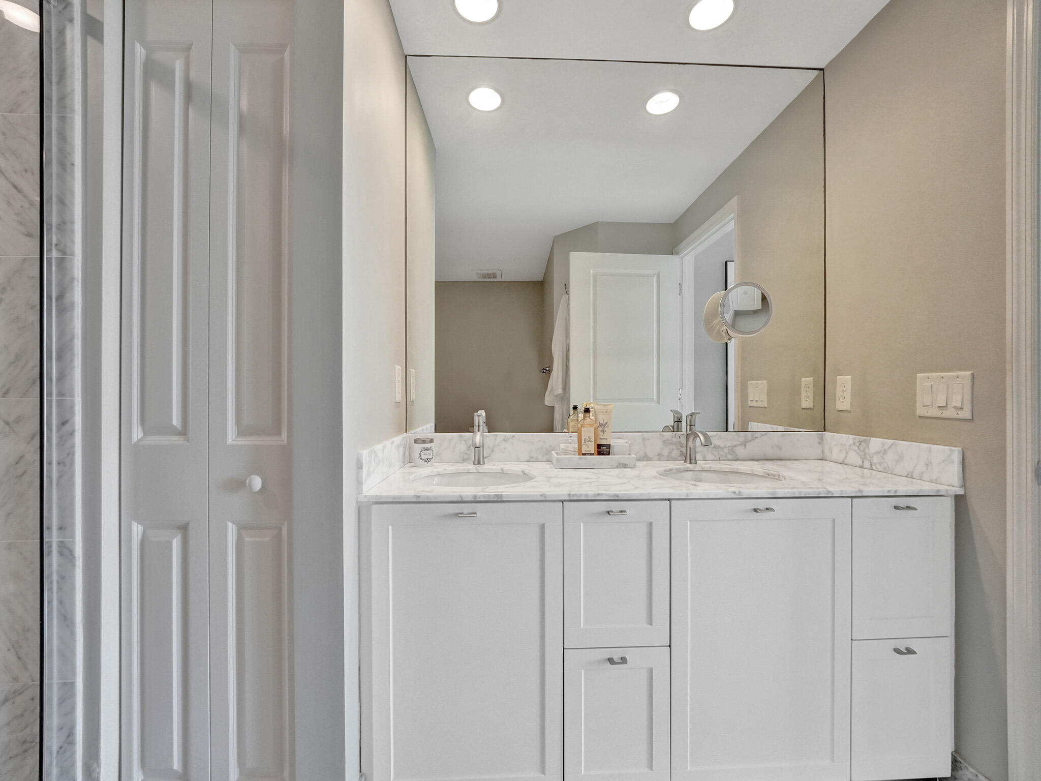 225 Northeast 1st Street, Unit 412 Delray Beach, FL 33444 - Photo 36 of 49 a bathroom with a granite countertop sink and a mirror