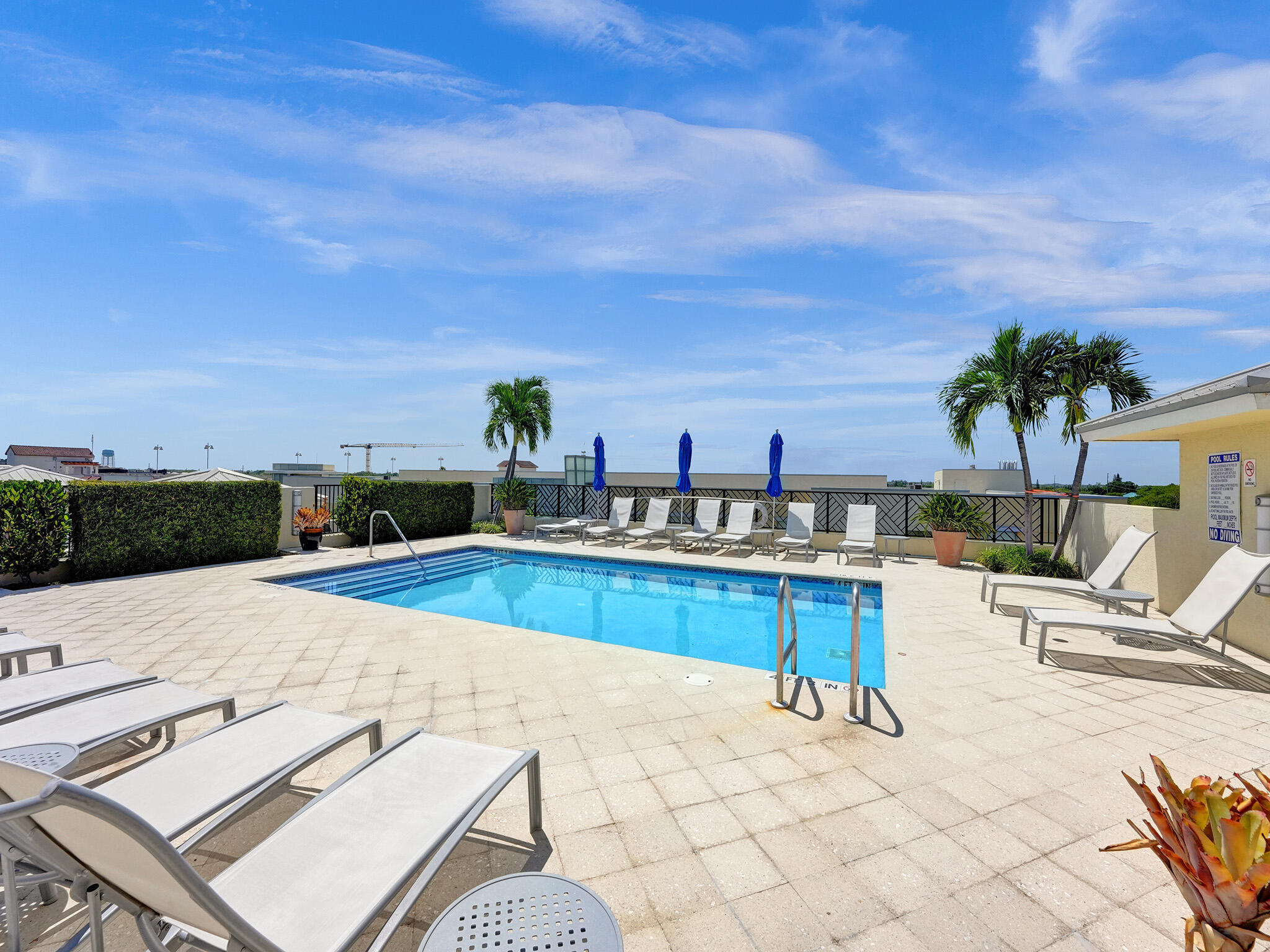 225 Northeast 1st Street, Unit 412 Delray Beach, FL 33444 - Photo 39 of 49 a view of a swimming pool with a lounge chair