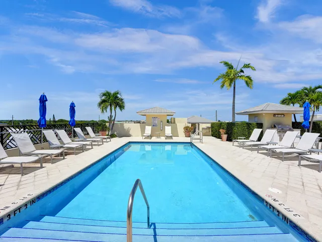 a view of a swimming pool with a lounge chair