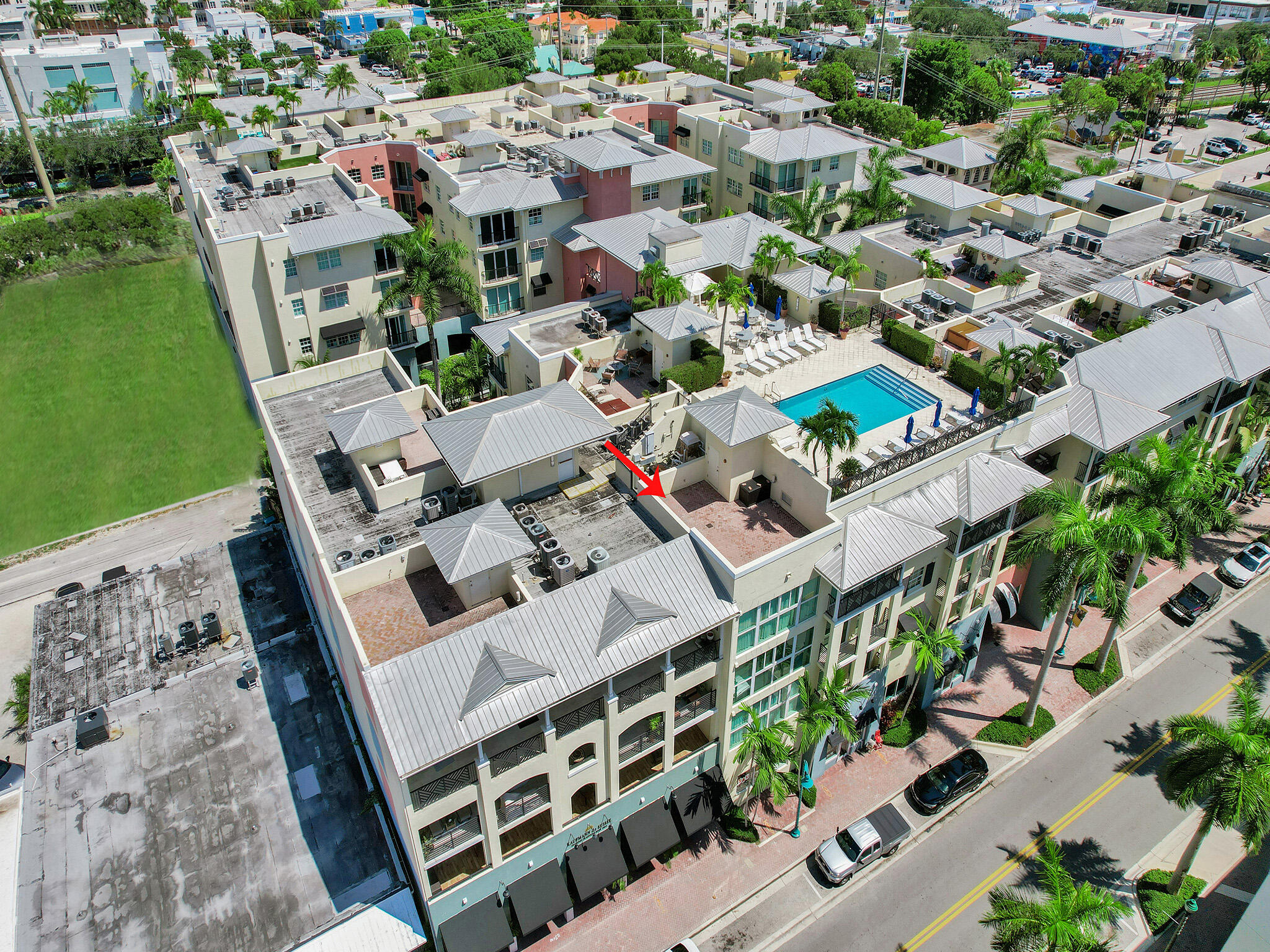 225 Northeast 1st Street, Unit 412 Delray Beach, FL 33444 - Photo 42 of 49 an aerial view of multiple houses with yard