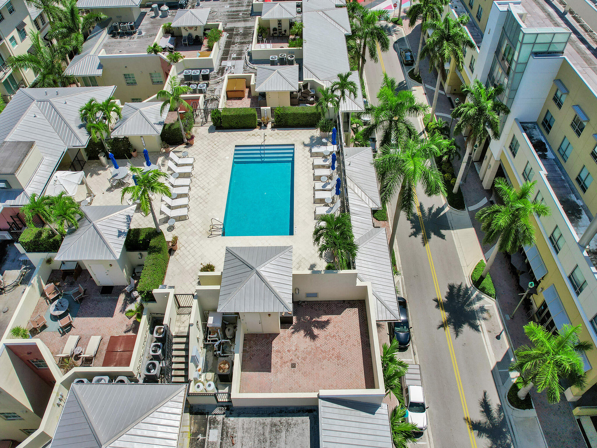 225 Northeast 1st Street, Unit 412 Delray Beach, FL 33444 - Photo 46 of 49 an aerial view of multiple houses with yard