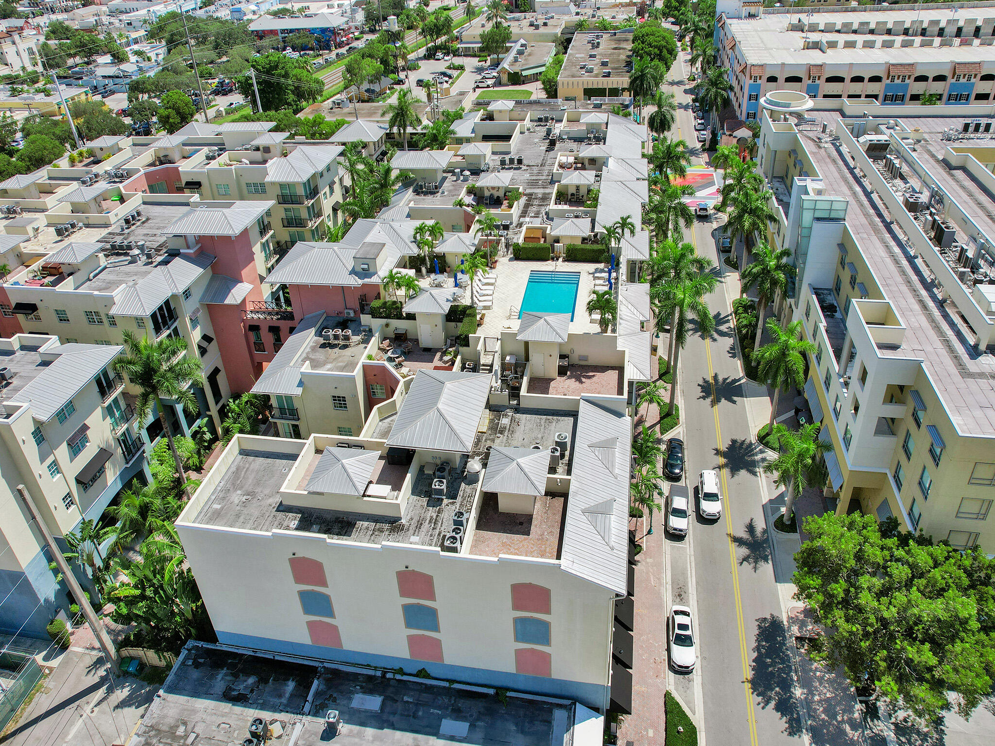 225 Northeast 1st Street, Unit 412 Delray Beach, FL 33444 - Photo 47 of 49 an aerial view of a house with a yard and seating area