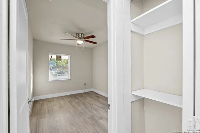 a view of an empty room with a window