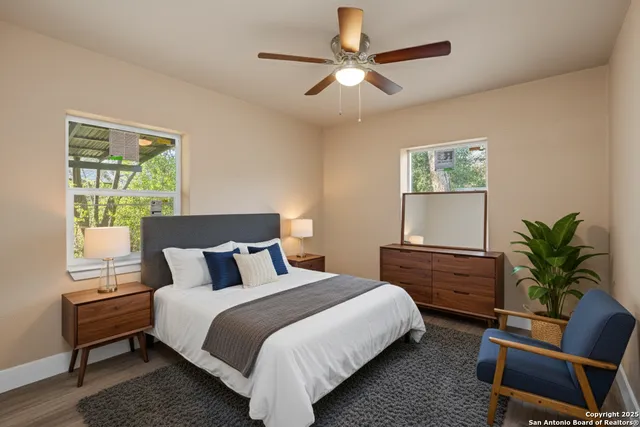 a bedroom with a large bed and a chair