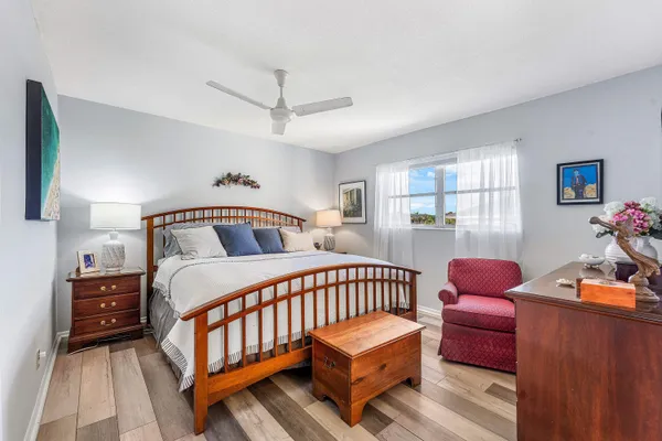 a bedroom with furniture and a window