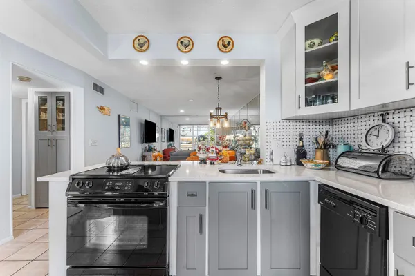 a kitchen with stainless steel appliances granite countertop a stove and cabinets