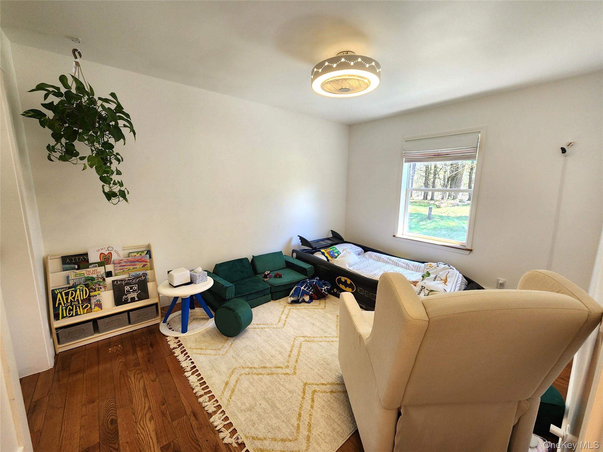 142 Old Tacy Road Bethel, NY 12783 - Photo 20 of 38 a bedroom with a bed and a window