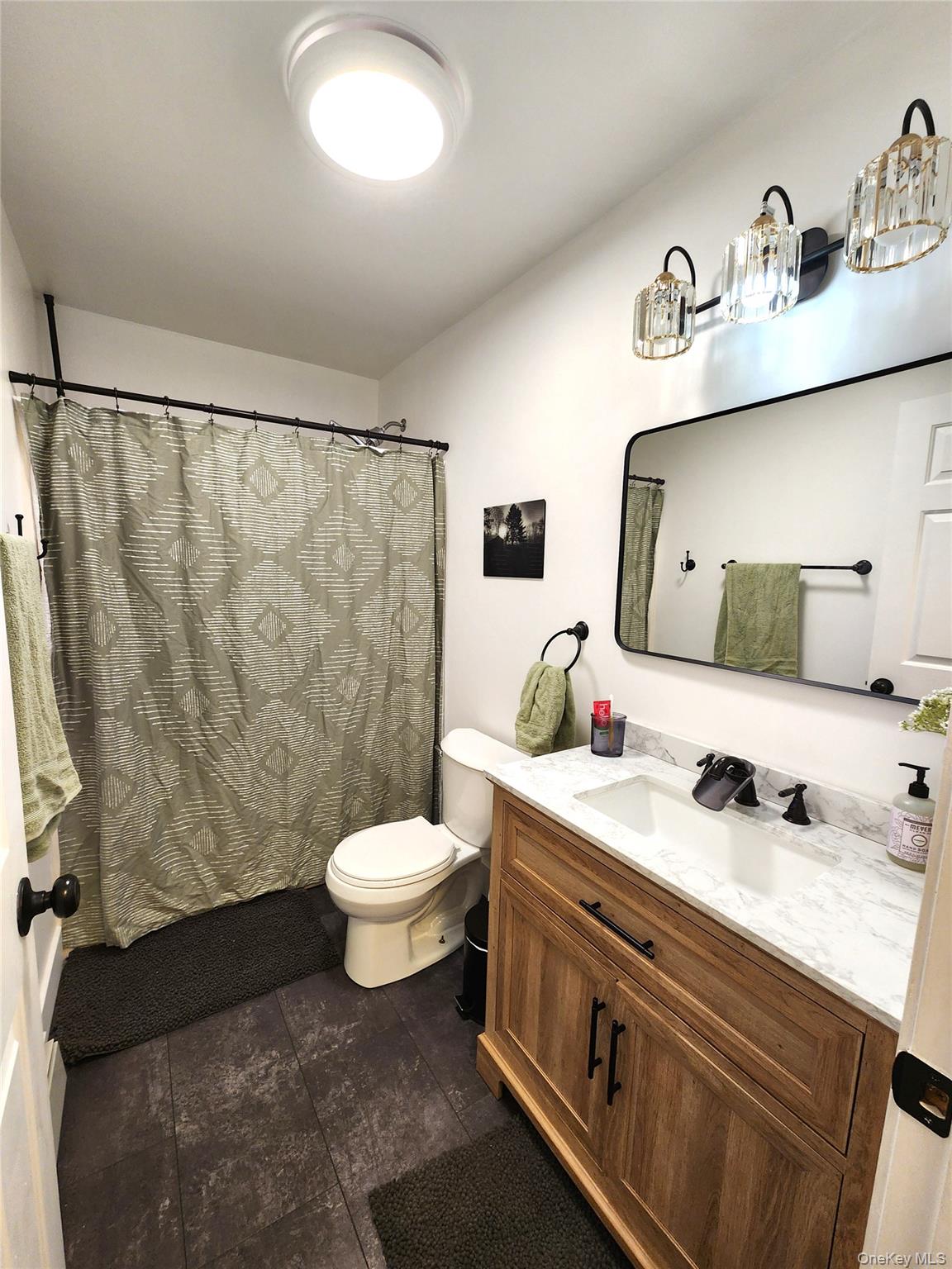 142 Old Tacy Road Bethel, NY 12783 - Photo 21 of 38 a bathroom with a sink mirror vanity and toilet