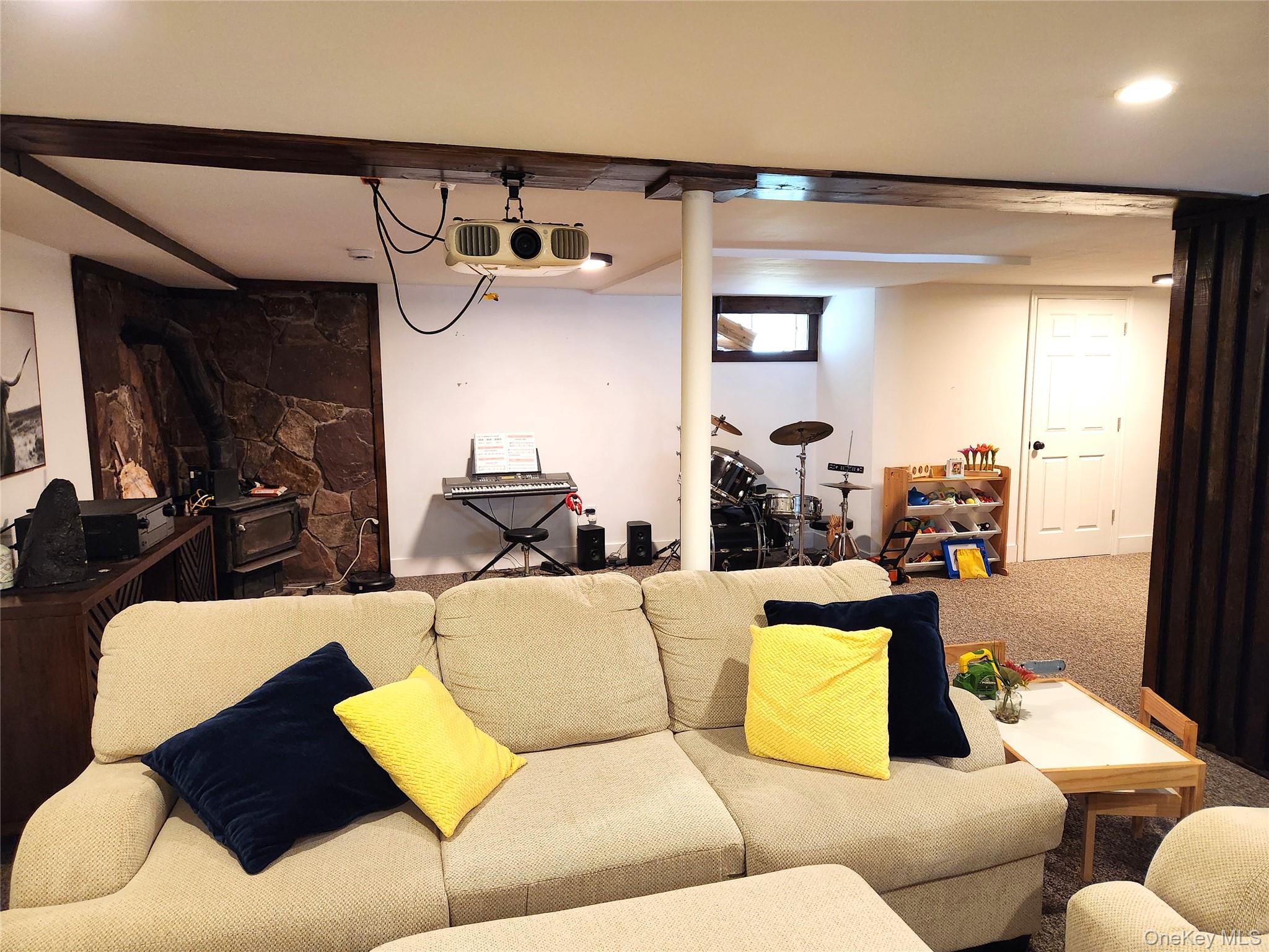 142 Old Tacy Road Bethel, NY 12783 - Photo 24 of 38 a living room with furniture and a large mirror