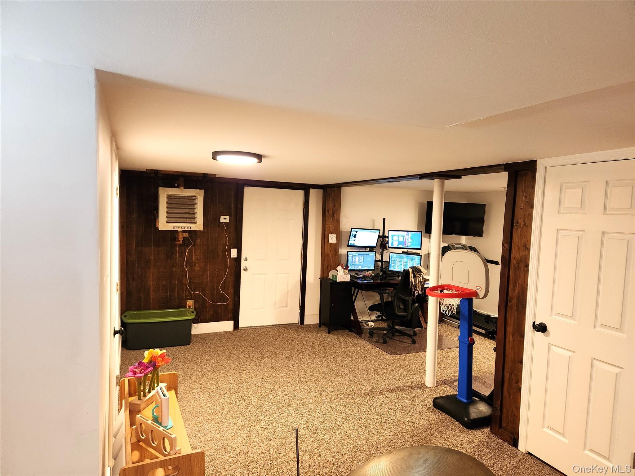 142 Old Tacy Road Bethel, NY 12783 - Photo 27 of 38 a view of a livingroom with furniture and gym equipment