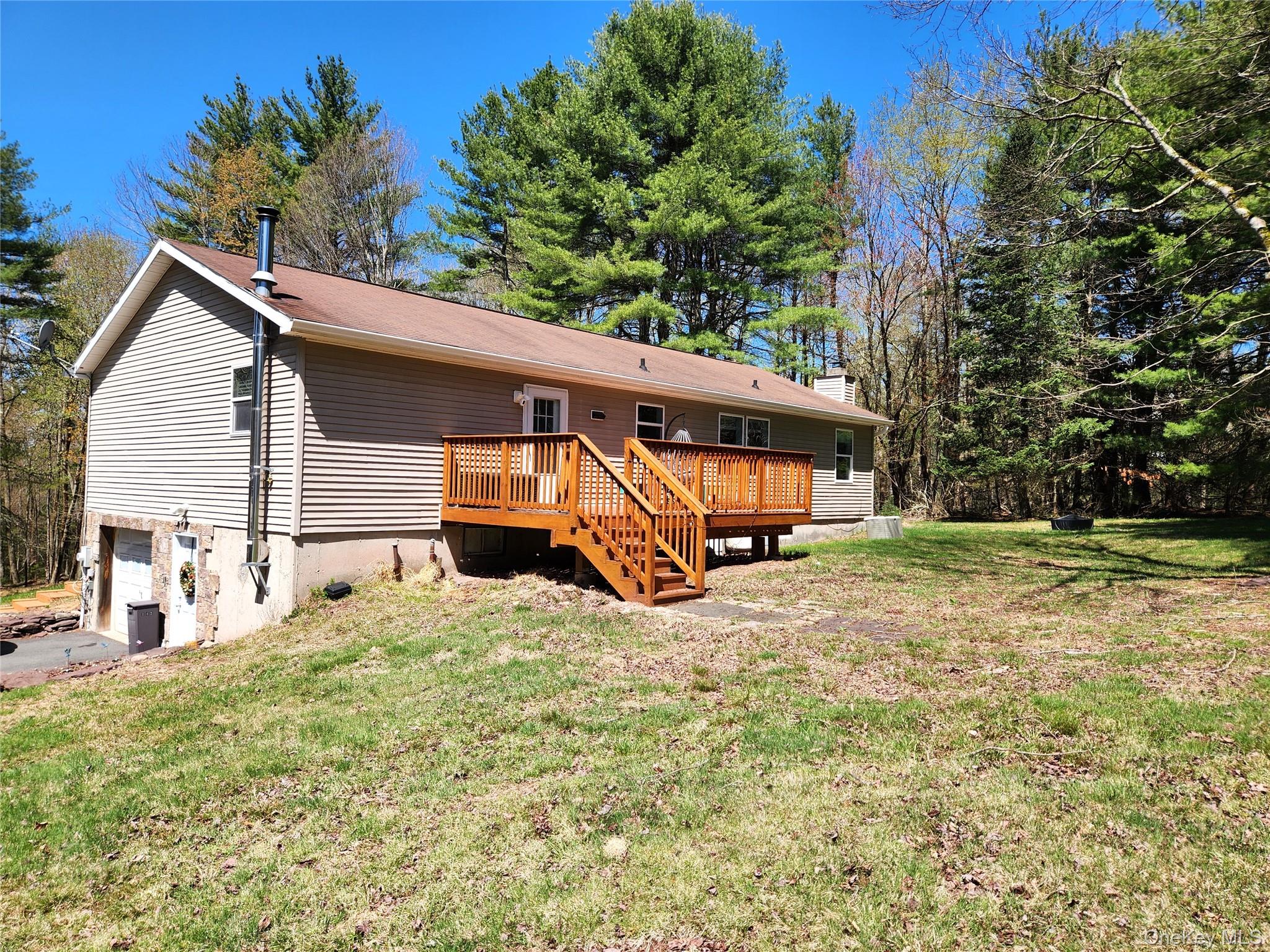 142 Old Tacy Road Bethel, NY 12783 - Photo 3 of 38 a view of a house with backyard and sitting area