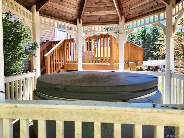 a view of a porch with wooden floor