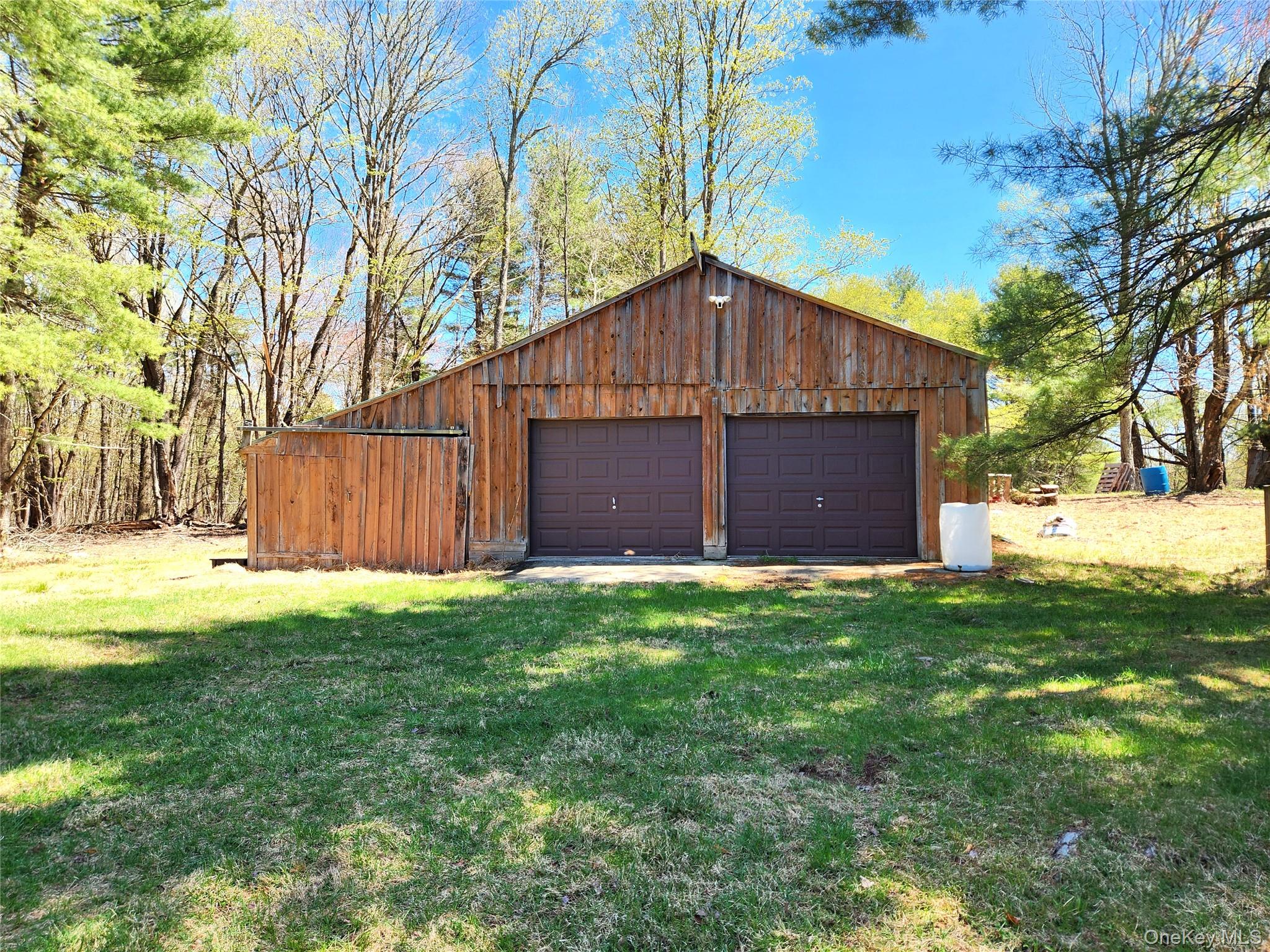 142 Old Tacy Road Bethel, NY 12783 - Photo 32 of 38 a front view of house with yard and trees