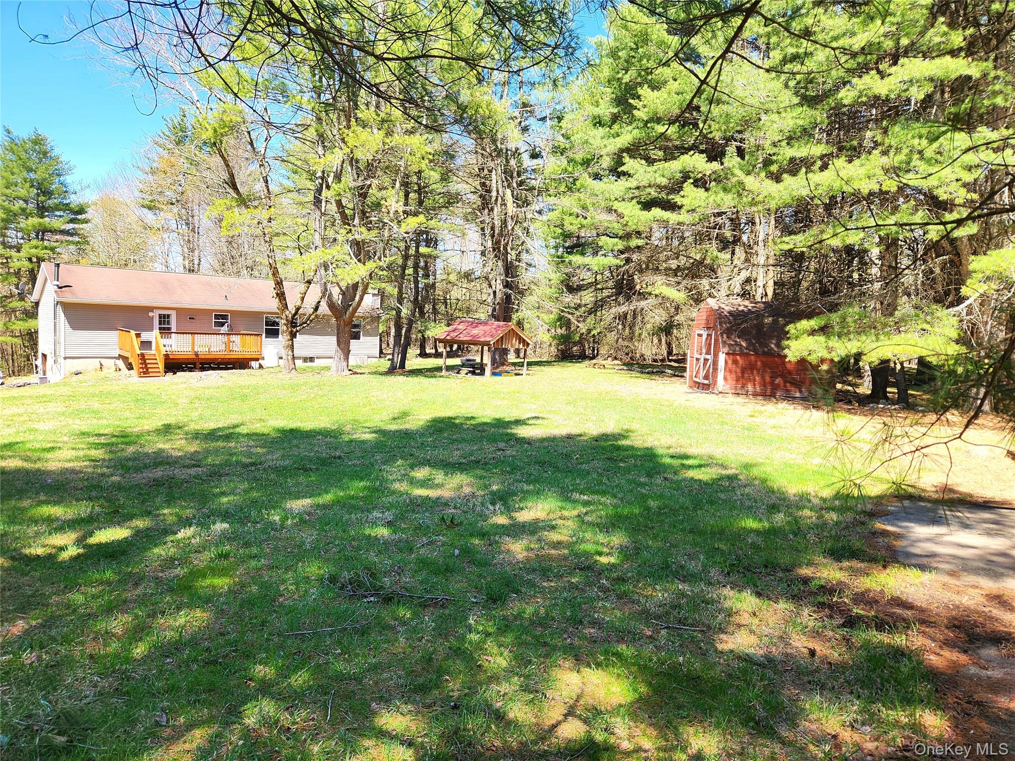 142 Old Tacy Road Bethel, NY 12783 - Photo 33 of 38 a view of yard with swimming pool and trees