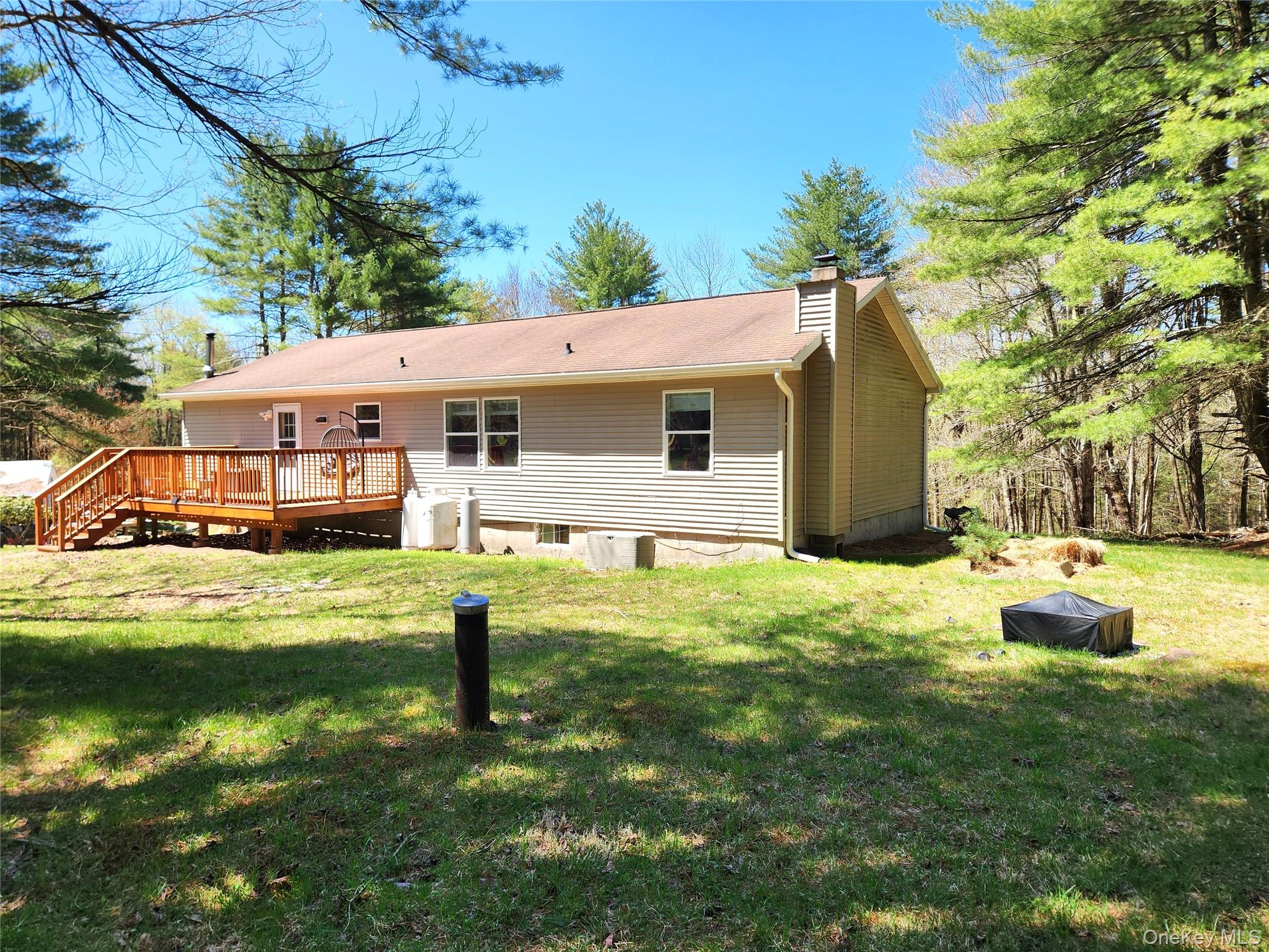 142 Old Tacy Road Bethel, NY 12783 - Photo 4 of 38 a front view of house with yard and seating area