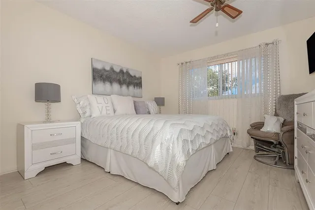 a bedroom with a bed and a chair