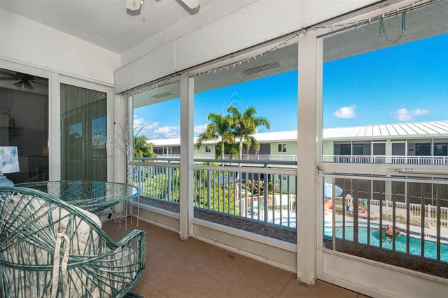a view of a balcony with furniture