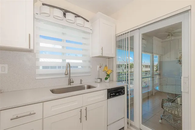 a bathroom with a shower sink and mirror