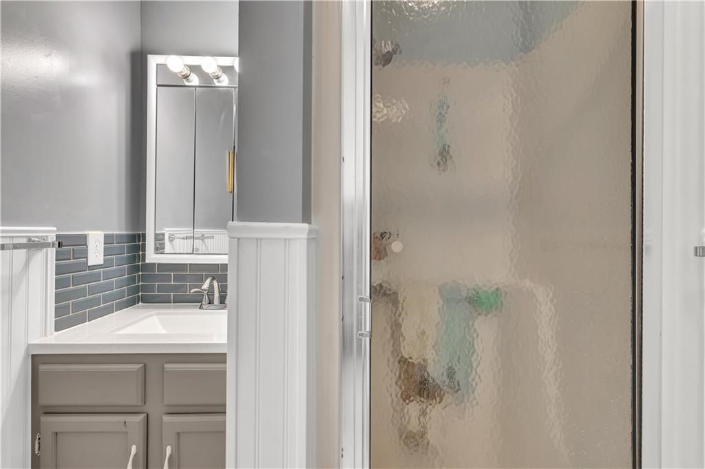 35 Pine Arbor Lane, Unit 202 Vero Beach, FL 32962 - Photo 12 of 16 a bathroom with a sink and mirror