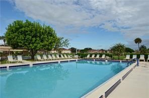 35 Pine Arbor Lane, Unit 202 Vero Beach, FL 32962 - Photo 14 of 16 a view of a swimming pool with a lake view