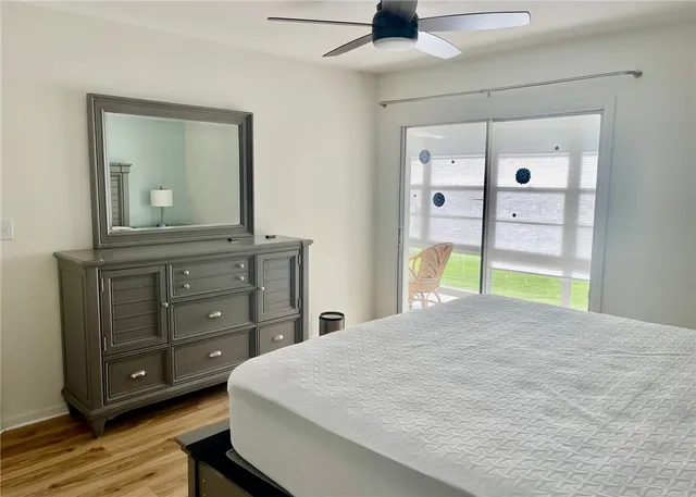 a bedroom with furniture and a window