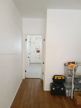 a room with a bed and gym equipment