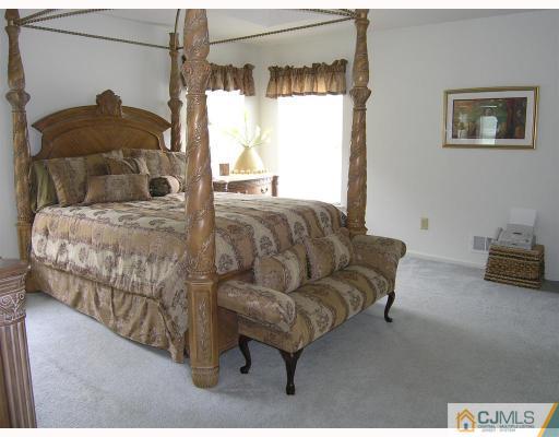 40 Timber Ridge Road North Brunswick, NJ 08902 - Photo 7 of 8 a bedroom with a bed and window