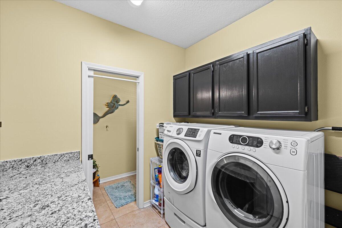 306 Tala Way Niceville, FL 32578 - Photo 13 of 47 a view of a storage & utility room with washer and dryer