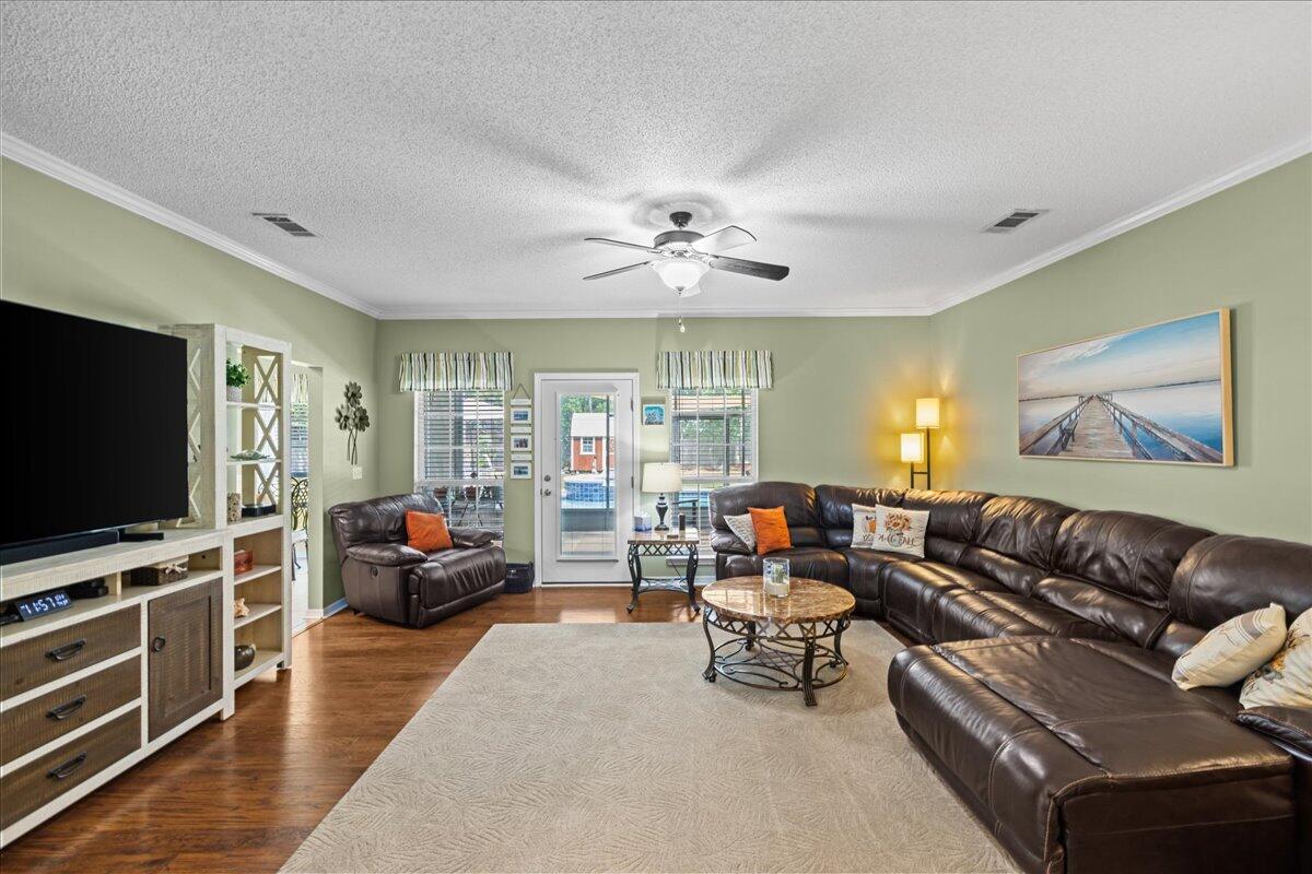 306 Tala Way Niceville, FL 32578 - Photo 16 of 47 a living room with furniture and a flat screen tv