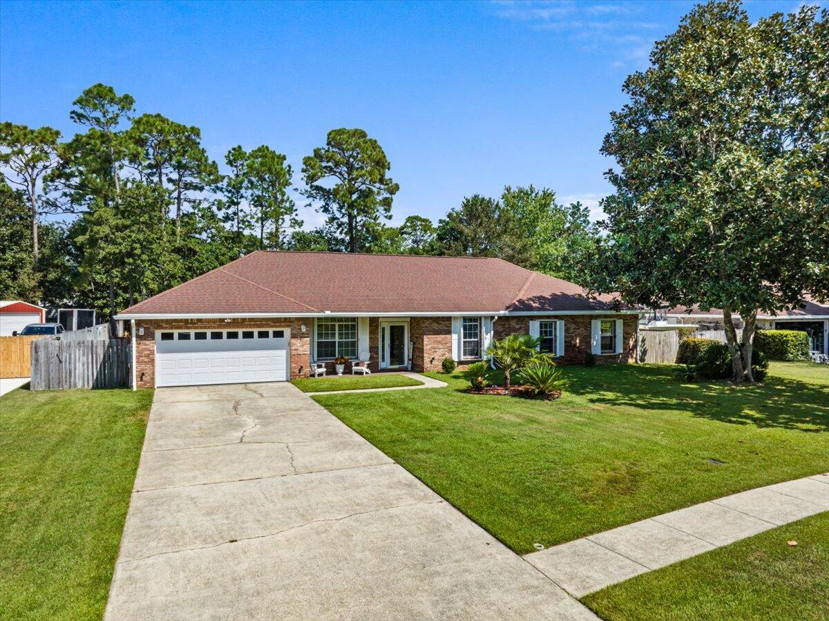 306 Tala Way Niceville, FL 32578 - Photo 2 of 47 a front view of a house with a yard