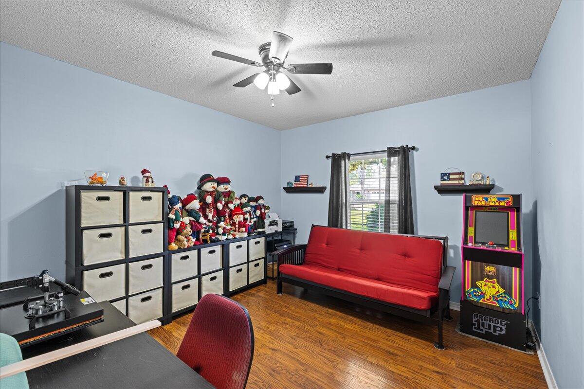306 Tala Way Niceville, FL 32578 - Photo 21 of 47 a living room with furniture cabinets and a window