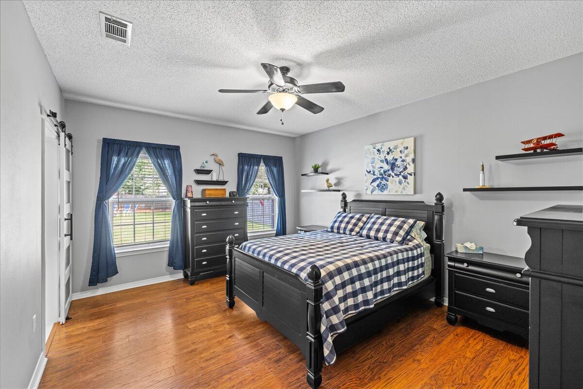 306 Tala Way Niceville, FL 32578 - Photo 23 of 47 a bedroom with a bed next to a window with closet