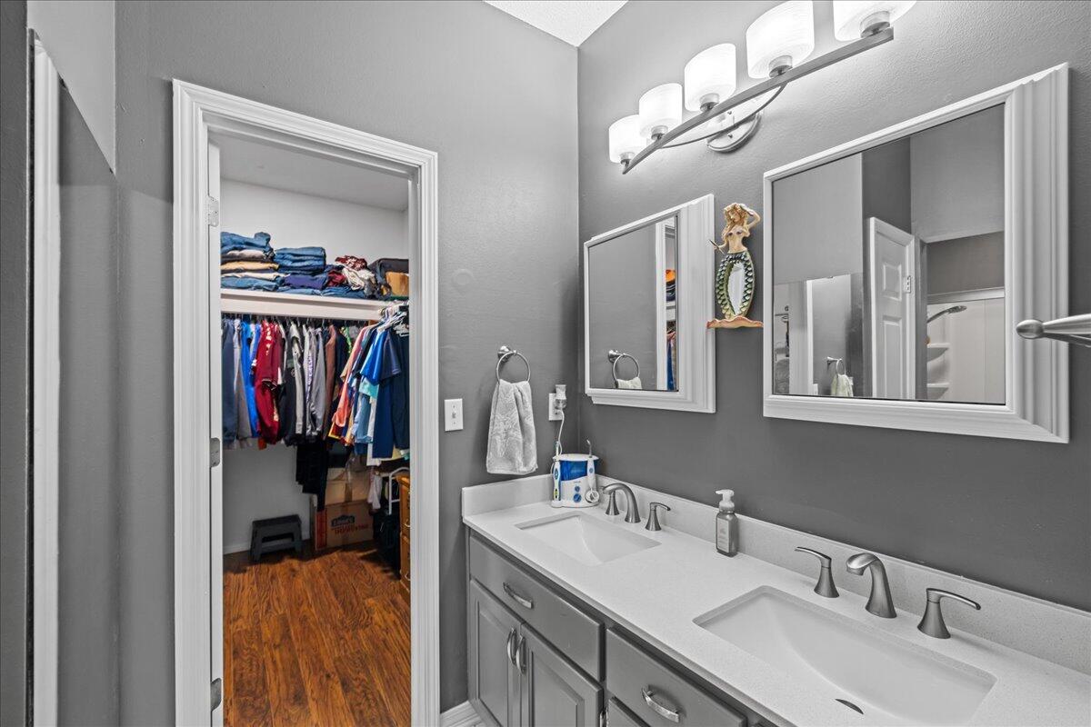 306 Tala Way Niceville, FL 32578 - Photo 26 of 47 a en suite bathroom with a double vanity sink and a mirror