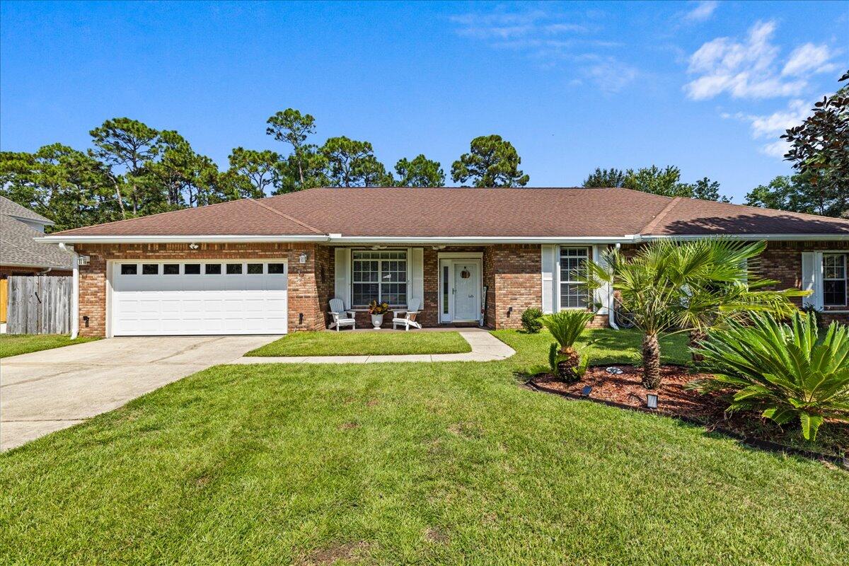 306 Tala Way Niceville, FL 32578 - Photo 3 of 47 a front view of a house with a yard
