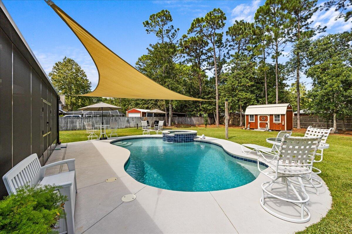 306 Tala Way Niceville, FL 32578 - Photo 31 of 47 a view of a swimming pool with sitting area