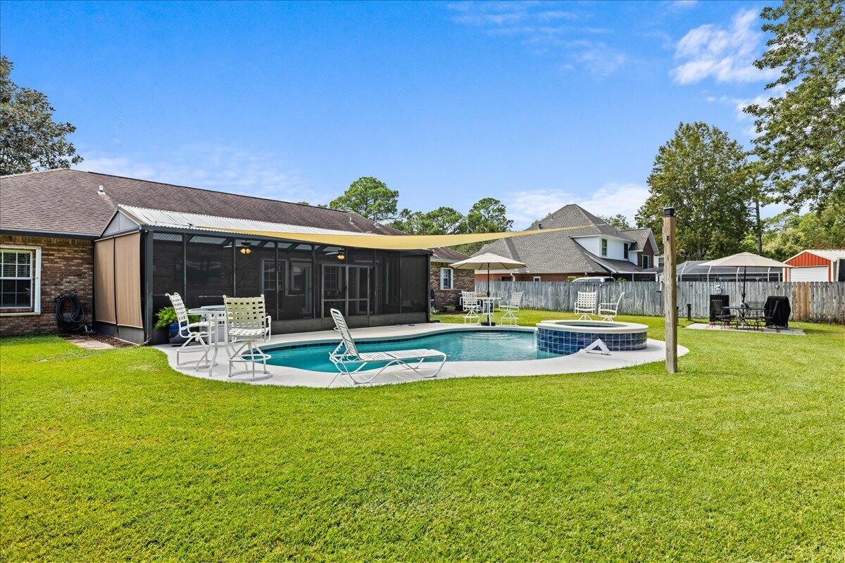 306 Tala Way Niceville, FL 32578 - Photo 32 of 47 a view of a house with swimming pool and porch with furniture