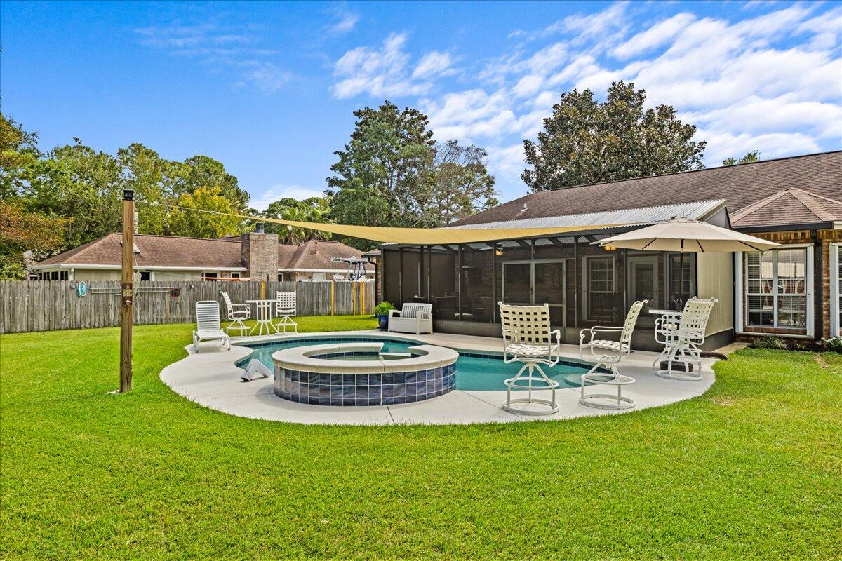 306 Tala Way Niceville, FL 32578 - Photo 33 of 47 a view of a house with backyard sitting area and swimming pool