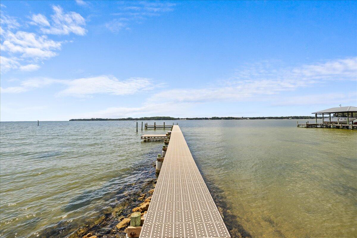 306 Tala Way Niceville, FL 32578 - Photo 39 of 47 a view of a lake with a large mountain