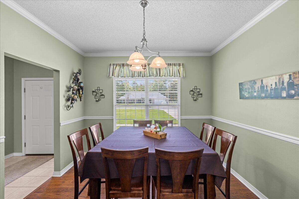 306 Tala Way Niceville, FL 32578 - Photo 7 of 47 a view of a dining room with furniture window and outside view