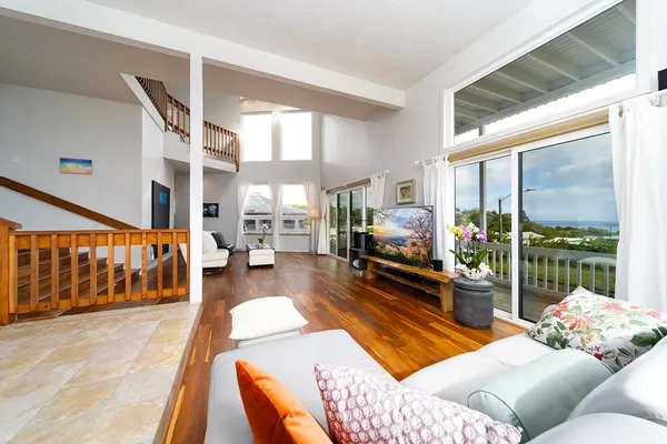 a living room filled with furniture and a table