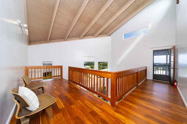a view of a porch with wooden floor