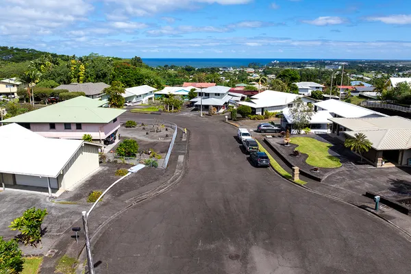 aerial view of a house with a ocean view
