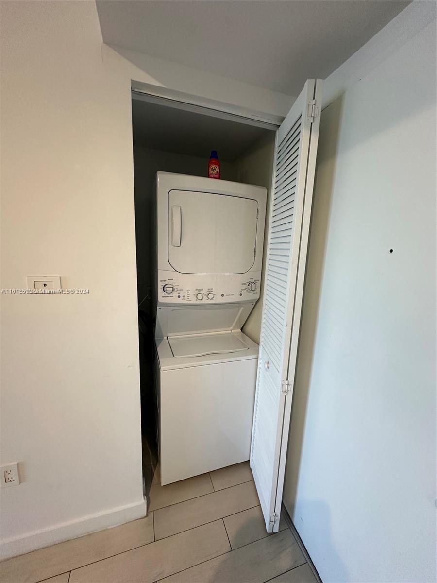 2602 East Hallandale Beach Boulevard, Unit R807 Hallandale Beach, FL 33009 - Photo 15 of 37 a utility room with dryer and washer
