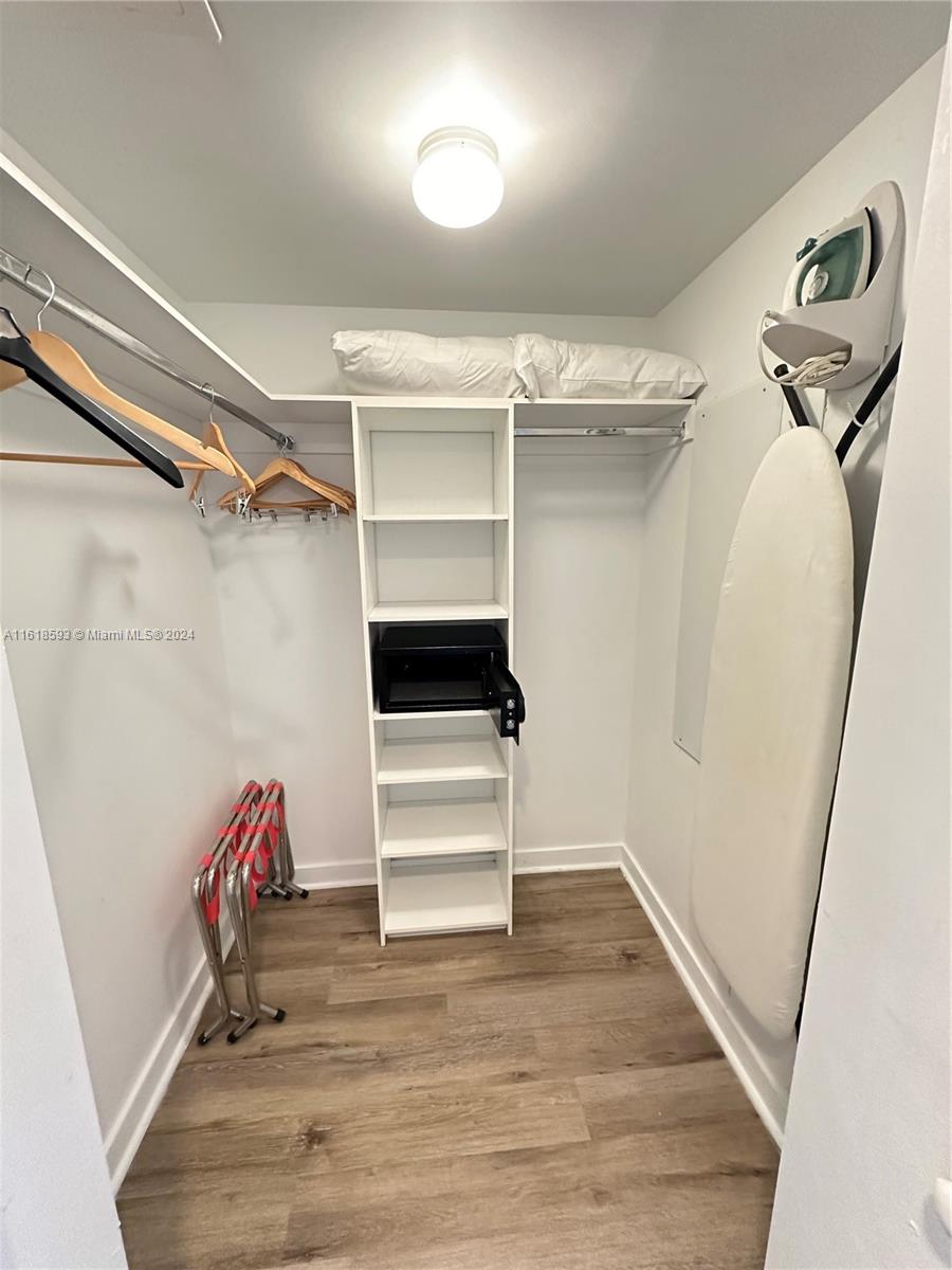 2602 East Hallandale Beach Boulevard, Unit R807 Hallandale Beach, FL 33009 - Photo 28 of 37 a view of walk in closet with empty racks