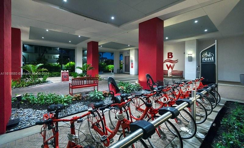 2602 East Hallandale Beach Boulevard, Unit R807 Hallandale Beach, FL 33009 - Photo 6 of 37 a group of people sitting in front of a house